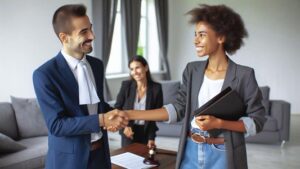 a male lawyer and female client shaking hands after a successful eviction defense
